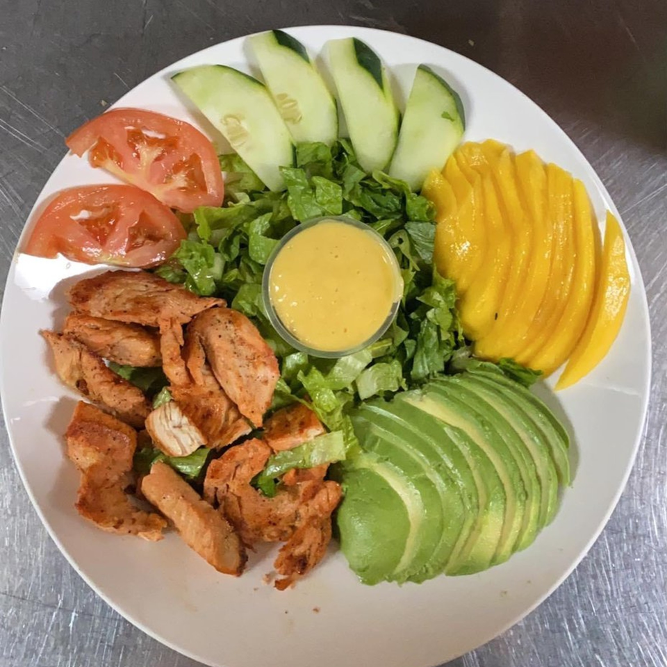 Mi Favorito Mexican Restaurant's chicken salad with lettuce, tomatoes, cucumbers, mango, avocado, and dressing.